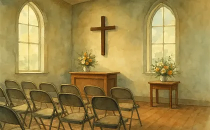 A respectful church chapel scene with flowers and chairs prepared for a memorial service.
