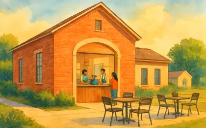 An illustration of a student-run coffee shop and outdoor seating area inside a renovated community learning building.
